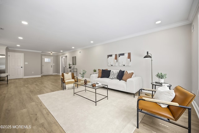 12 Weston Ct, Marlboro, NJ 07746 - living area with recessed lighting, light wood-style floors, and ornamental molding