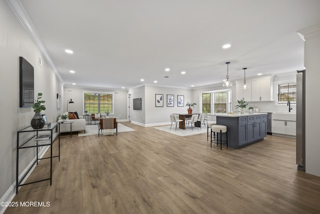 12 Weston Ct, Marlboro, NJ 07746 - living area with crown molding, recessed lighting, plenty of natural light, and light wood-style flooring