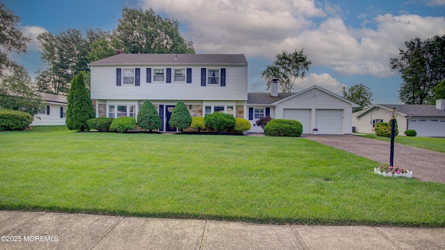 20 Kenwood Ln, Old Bridge, NJ 08857 - colonial house featuring a chimney, a garage, driveway, and a front lawn