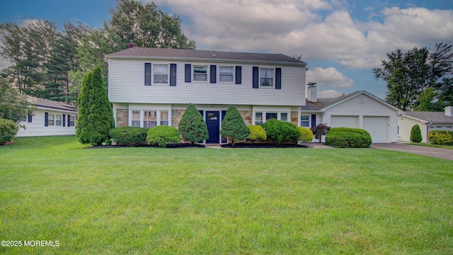 20 Kenwood Ln, Old Bridge, NJ 08857 - colonial house featuring a front lawn, a garage, stone siding, asphalt driveway, and a chimney