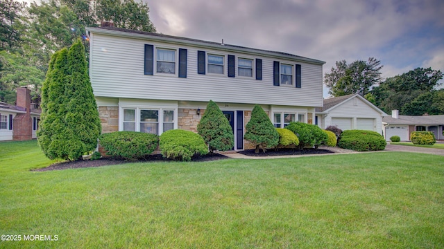 20 Kenwood Ln, Old Bridge, NJ 08857 - colonial-style house featuring stone siding, a front lawn, and a garage