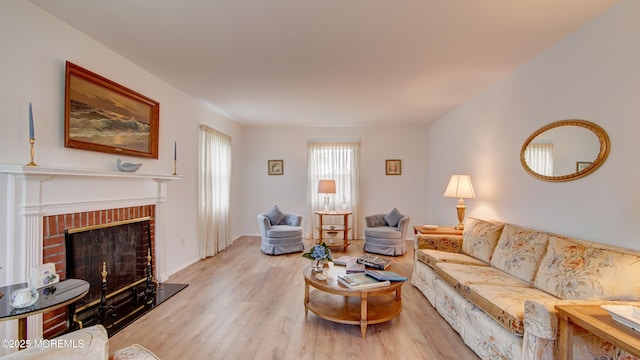20 Kenwood Ln, Old Bridge, NJ 08857 - living room with light wood-style floors and a fireplace