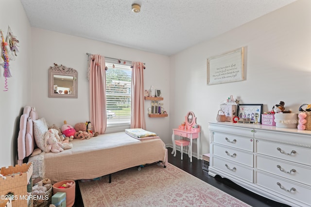 102 Oak Glen Rd, Toms River, NJ 08753 - bedroom featuring dark wood-style floors and a textured ceiling