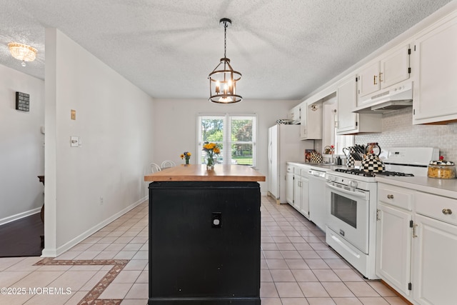 102 Oak Glen Rd, Toms River, NJ 08753 - kitchen with white appliances, under cabinet range hood, a center island, light tile patterned flooring, and a textured ceiling