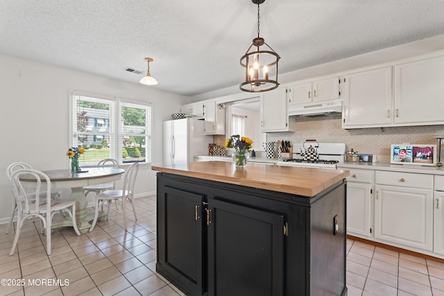 102 Oak Glen Rd, Toms River, NJ 08753 - kitchen with white cabinets, white appliances, wood counters, light tile patterned floors, and a textured ceiling
