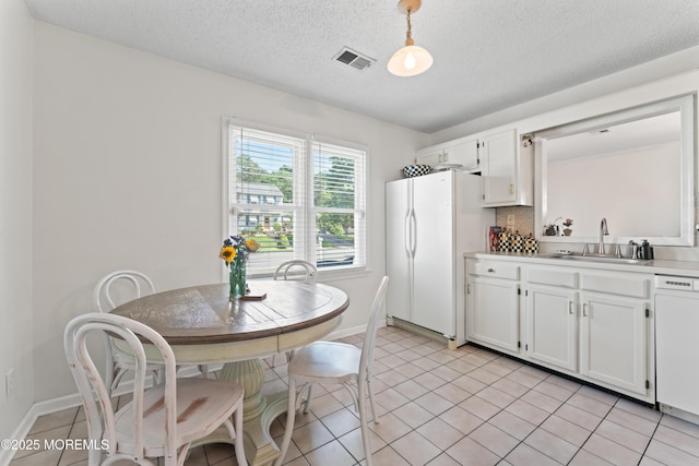 102 Oak Glen Rd, Toms River, NJ 08753 - kitchen with white appliances, white cabinetry, light countertops, light tile patterned floors, and a textured ceiling