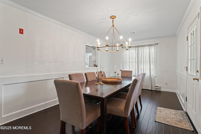 102 Oak Glen Rd, Toms River, NJ 08753 - dining space featuring a chandelier, ornamental molding, dark wood-type flooring, and a baseboard heating unit