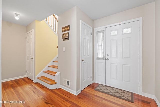 7 Warbler Rd, Marlboro, NJ 07746 - foyer with light wood-style flooring and stairs