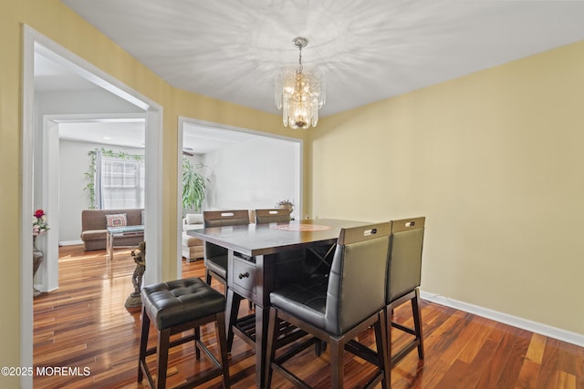 7 Warbler Rd, Marlboro, NJ 07746 - dining area with a chandelier and wood finished floors