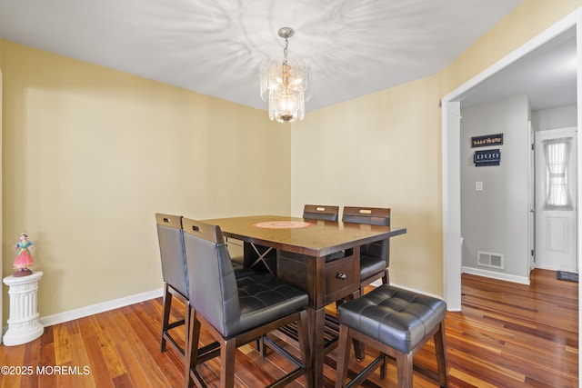 7 Warbler Rd, Marlboro, NJ 07746 - dining space featuring a chandelier and wood finished floors