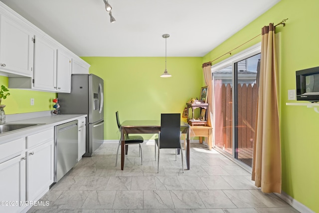 7 Warbler Rd, Marlboro, NJ 07746 - kitchen featuring stainless steel appliances, white cabinets, decorative light fixtures, and light countertops