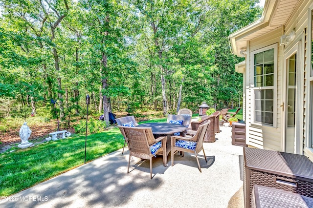 43 Westport Dr, Barnegat, NJ 08005 - view of patio featuring outdoor dining space and view of wooded area