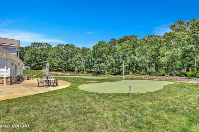 43 Westport Dr, Barnegat, NJ 08005 - view of grassy yard with a putting area and a patio