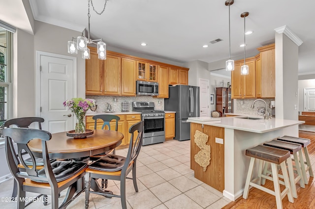 43 Westport Dr, Barnegat, NJ 08005 - kitchen with stainless steel appliances, crown molding, a peninsula, backsplash, and glass insert cabinets