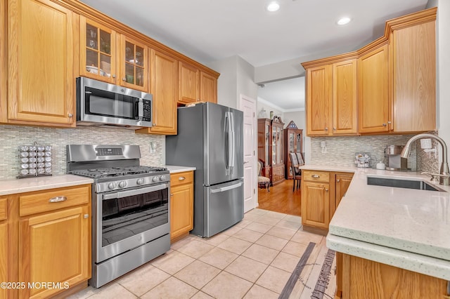 43 Westport Dr, Barnegat, NJ 08005 - kitchen with appliances with stainless steel finishes, light tile patterned floors, crown molding, backsplash, and recessed lighting