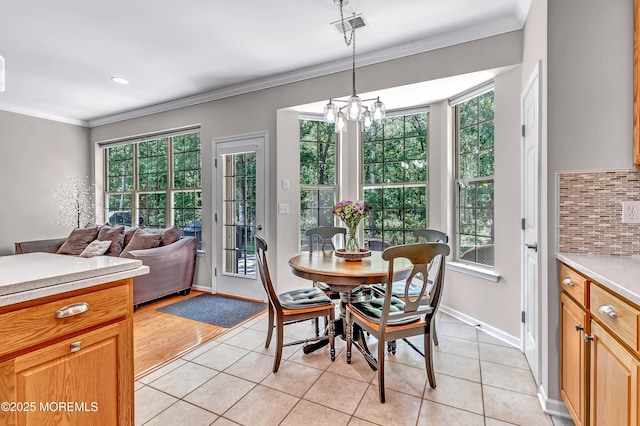 43 Westport Dr, Barnegat, NJ 08005 - dining area with plenty of natural light, light tile patterned flooring, crown molding, and a chandelier