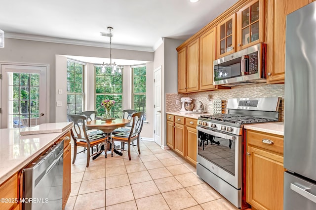 43 Westport Dr, Barnegat, NJ 08005 - kitchen featuring appliances with stainless steel finishes, decorative backsplash, ornamental molding, a chandelier, and light tile patterned floors