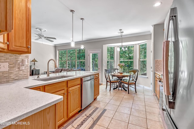 43 Westport Dr, Barnegat, NJ 08005 - kitchen featuring appliances with stainless steel finishes, tasteful backsplash, light tile patterned floors, a peninsula, and crown molding