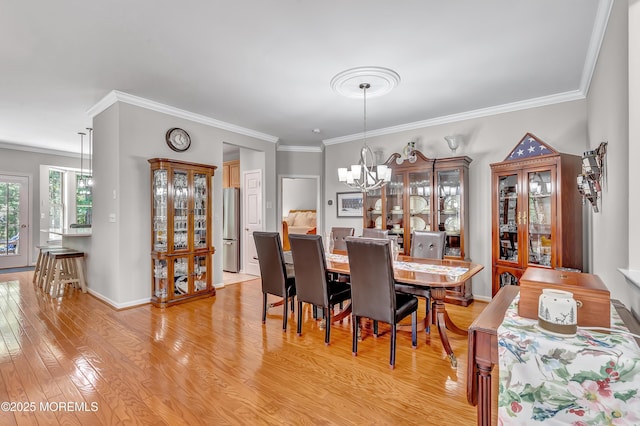 43 Westport Dr, Barnegat, NJ 08005 - dining area featuring a chandelier, light wood-type flooring, and crown molding