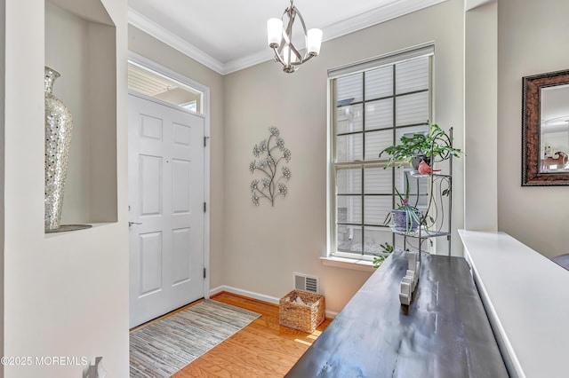 43 Westport Dr, Barnegat, NJ 08005 - entryway with wood finished floors, ornamental molding, and a chandelier