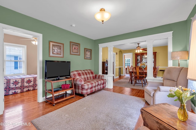 833 Lincoln St, Red Bank, NJ 07701 - living room featuring decorative columns, wood finished floors, and a ceiling fan