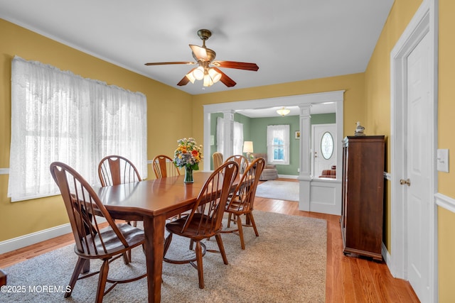 833 Lincoln St, Red Bank, NJ 07701 - dining area with ornate columns, a ceiling fan, and light wood finished floors