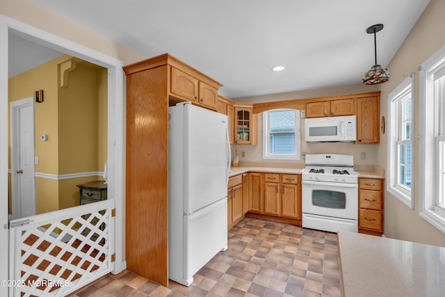 833 Lincoln St, Red Bank, NJ 07701 - kitchen with white appliances, light countertops, glass insert cabinets, recessed lighting, and decorative light fixtures