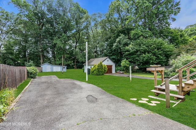 833 Lincoln St, Red Bank, NJ 07701 - view of patio / terrace featuring driveway, an outbuilding, and a garage