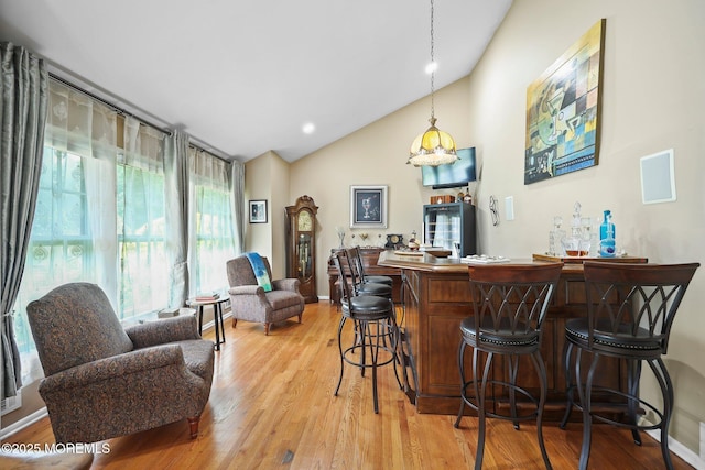 3 Sudbury Rd, Morganville, NJ 07751 - indoor dry bar with light wood-type flooring, decorative light fixtures, and high vaulted ceiling