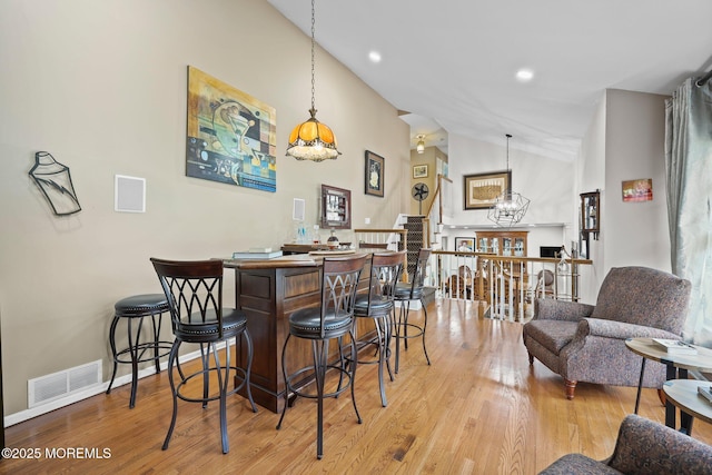 3 Sudbury Rd, Morganville, NJ 07751 - indoor dry bar with light wood-type flooring, a chandelier, pendant lighting, high vaulted ceiling, and recessed lighting