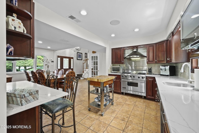 3 Sudbury Rd, Morganville, NJ 07751 - kitchen featuring luxury stove, wall chimney range hood, backsplash, open shelves, and recessed lighting