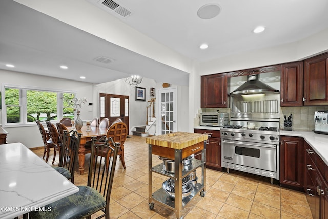 3 Sudbury Rd, Morganville, NJ 07751 - kitchen with wall chimney range hood, designer stove, light countertops, decorative backsplash, and recessed lighting