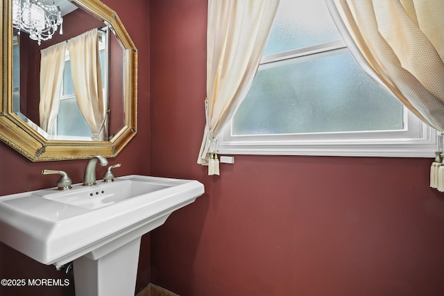 3 Sudbury Rd, Morganville, NJ 07751 - bathroom featuring a sink and a chandelier