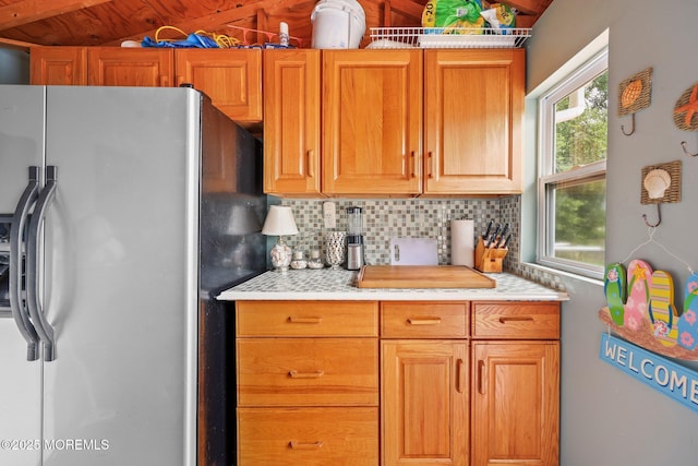 3 Sudbury Rd, Morganville, NJ 07751 - kitchen featuring stainless steel fridge with ice dispenser, backsplash, and light countertops