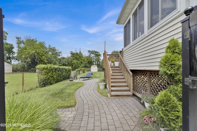 405 Orange Ave, Union Beach, NJ 07735 - fenced backyard with a storage unit, stairs, and a patio area