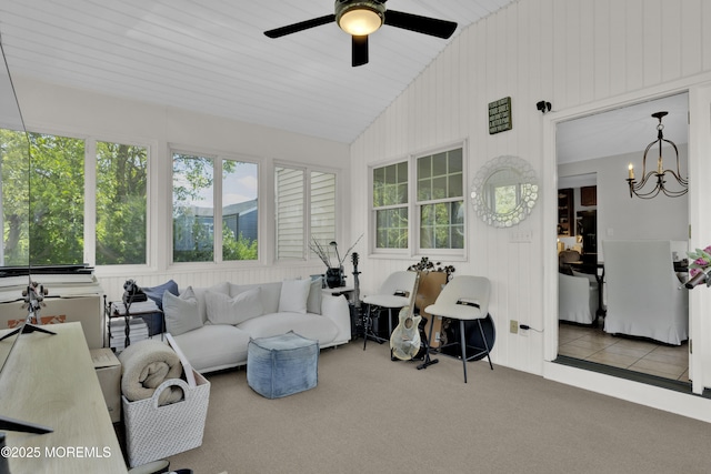 405 Orange Ave, Union Beach, NJ 07735 - carpeted living room featuring healthy amount of natural light, vaulted ceiling, a ceiling fan, and a chandelier