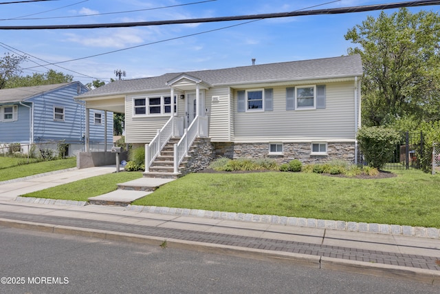 405 Orange Ave, Union Beach, NJ 07735 - view of front facade featuring concrete driveway, a front lawn, entry steps, a carport, and a shingled roof