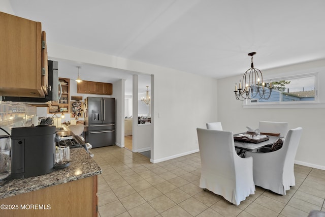 405 Orange Ave, Union Beach, NJ 07735 - dining space with a chandelier and light tile patterned floors