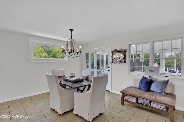 405 Orange Ave, Union Beach, NJ 07735 - dining space featuring a chandelier and light tile patterned flooring