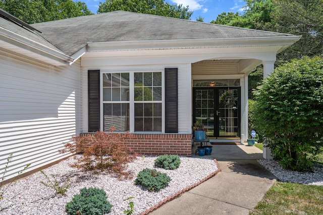 1 Silverspring Dr, Lakewood, NJ 08701 - doorway to property with roof with shingles and brick siding