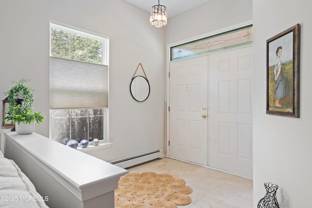 1 Silverspring Dr, Lakewood, NJ 08701 - foyer entrance with baseboard heating, a chandelier, and light tile patterned floors