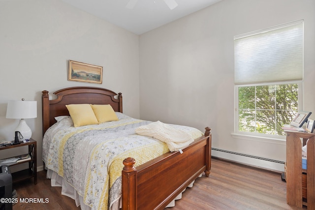 1 Silverspring Dr, Lakewood, NJ 08701 - bedroom featuring wood finished floors, a baseboard heating unit, and a ceiling fan