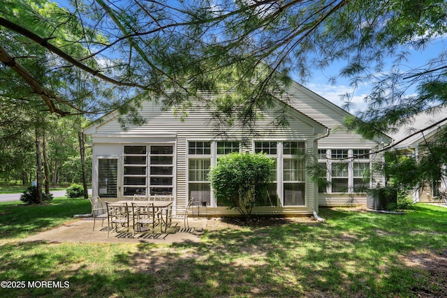 1 Silverspring Dr, Lakewood, NJ 08701 - back of property featuring a patio, a lawn, and a sunroom