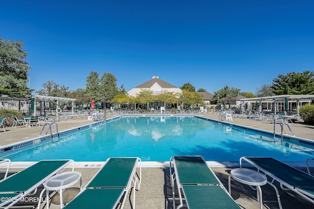 1 Silverspring Dr, Lakewood, NJ 08701 - community pool with a pergola and a patio