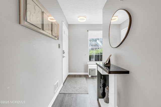 18 Remington Dr Unit 5, Freehold, NJ 07728 - hall featuring dark wood-type flooring and a textured ceiling
