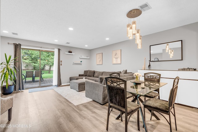 18 Remington Dr Unit 5, Freehold, NJ 07728 - dining area with light wood finished floors, a chandelier, and recessed lighting