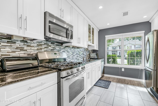 18 Remington Dr Unit 5, Freehold, NJ 07728 - kitchen featuring stainless steel appliances, white cabinets, backsplash, and recessed lighting
