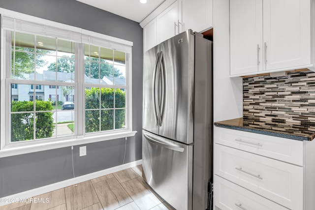 18 Remington Dr Unit 5, Freehold, NJ 07728 - kitchen with freestanding refrigerator, decorative backsplash, white cabinetry, dark stone counters, and recessed lighting