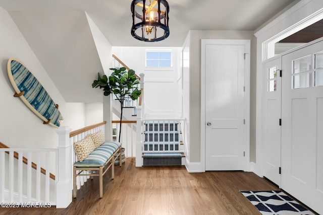 29 Allen St, Rumson, NJ 07760 - entrance foyer with wood finished floors, a chandelier, and stairway