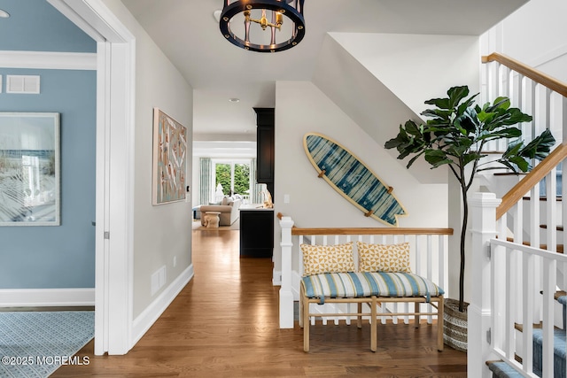 29 Allen St, Rumson, NJ 07760 - hall with a chandelier, wood finished floors, stairs, and recessed lighting